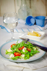 Arugula salad with feta cheese and cherry tomatoes