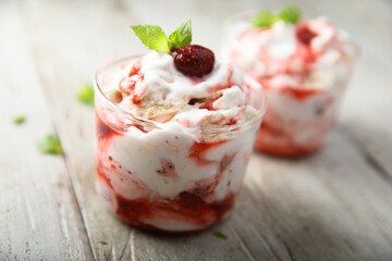 Homemade meringue dessert with raspberry and cream