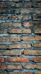 Old brick wall background, brick wall texture, structure. old broken brick, cement joints, close-up. crumbling from old age. construction, repair. concept of devastation, decline. Abstract Web Banner