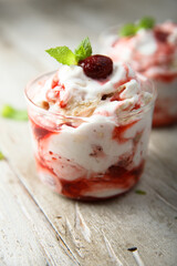 Homemade meringue dessert with raspberry and cream