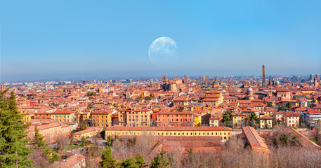 Panoramic view of red rooftops and buildings - Cityscape from above, view of Garisenda and Asinelli tower with full moon - Bologna, Italy "Elements of this image furnished by NASA" © muratart