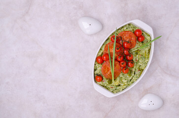 Spicy green mashed potatoes with fried tomatoes