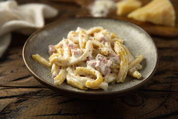 Traditional homemade pasta Carbonara with cheese and ham