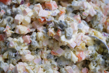 Salad of chopped vegetables and mayonnaise olivier background