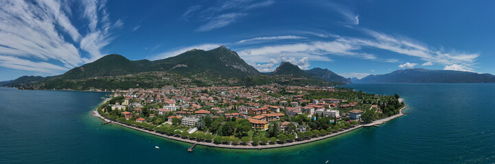 Fototapeta na wymiar Aerial panorama of the historic part of the city of Toscolano Maderno on Lake Garda. Toscolano Maderno panorama, Italy aerial view.