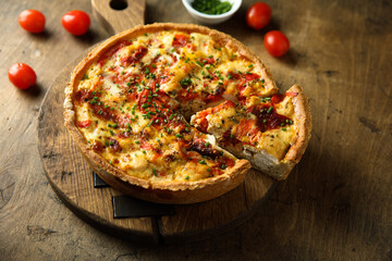 Homemade chicken quiche with tomatoes and pepper	