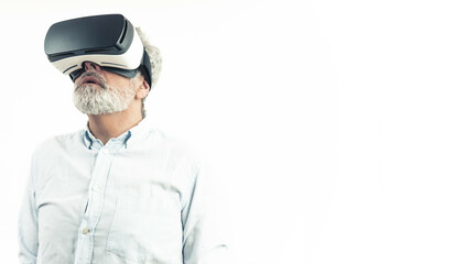 Middle-aged man wearing Virtual Reality set - VR goggles. Isolated on white. High quality photo