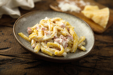 Traditional homemade pasta Carbonara with cheese and ham