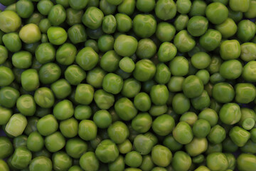Close up shot of fresh green Peas. Food texture and background