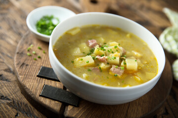 Traditional homemade pea soup with smoked bacon