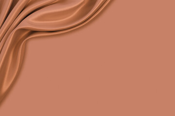 Beautiful elegant wavy beige / light brown satin silk luxury cloth fabric texture, abstract background design. Copy space. Card or banner