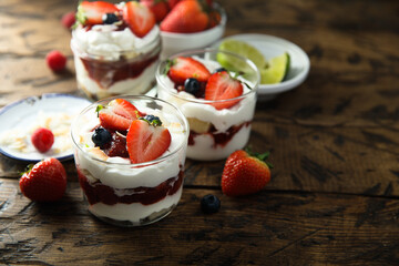 Homemade berry trifle with almond flakes