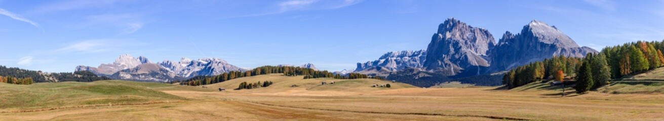 Super panorama of high mountain plateau Seiser Alm with Langkofel Group mountains. South Tyrol, Italy