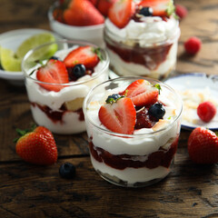 Homemade berry trifle with almond flakes