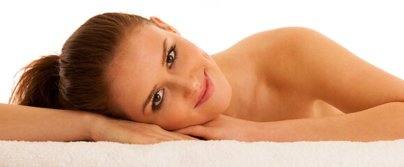 woman rests on white towel - conceptual photo for skin care and spa - 484375116