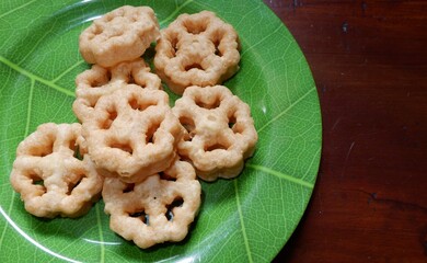 Achappam is a popular snack in Kerala which is crunchy and mildly sweet. It is made using a special achu or a round mould which is flower shaped. Rose cake, 