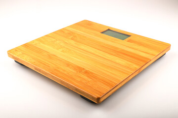 Top view of wooden digital weight scale isolated on white background.