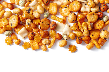 Japanese rice crackers, scattered on a white background, overhead flat lay shot with a place for text