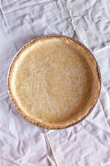 Pie blank - shortbread dough after baking, before filling with filling, in a round shape