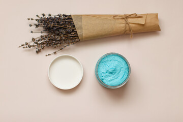 Shower scrub care for women on a plain background close-up. Spa treatments for the body bubble gum. Content filming of products.