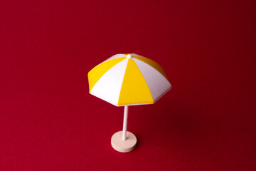 miniature colorful beach umbrella, isolated