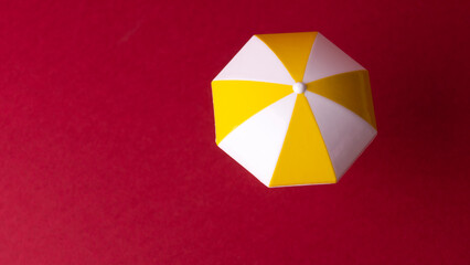 miniature colorful beach umbrella, isolated