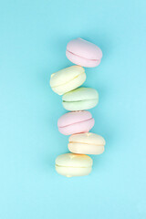Multi Colored Stacked Up marshmallow looks like French Macarons on Blue.