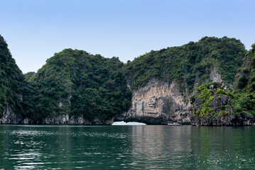 Fototapeta na wymiar Arch in a rock formation in Ha Long Bay