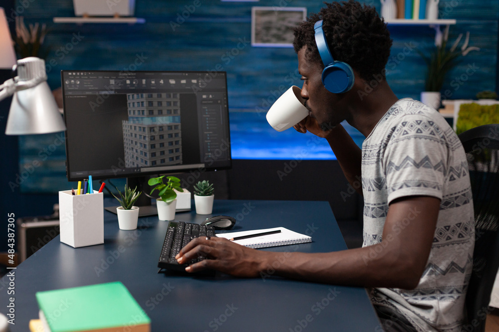 Poster architect developer wearing headset looking at building sketch analyzing prototype on computer worki