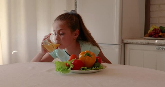 the child eats vegetables with pleasure. The girl eats healthy food. the concept of children's health