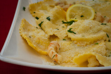 Delicious homemade ravioli filled with Adriatic sea trout and served under shrimp sauce