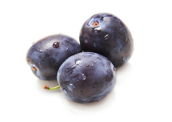 Plums isolated on a white background closeup