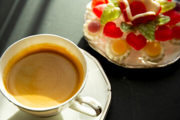Coffee and sweets, black background