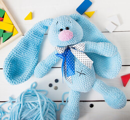 Toy knitted Bunny view from above Children's toys top view