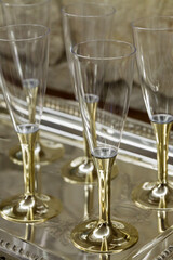 Gold stemmed champagne glasses