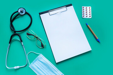 Green medical background, flat lay