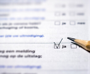 Checklist with completed tasks. Flags in points. selective focus