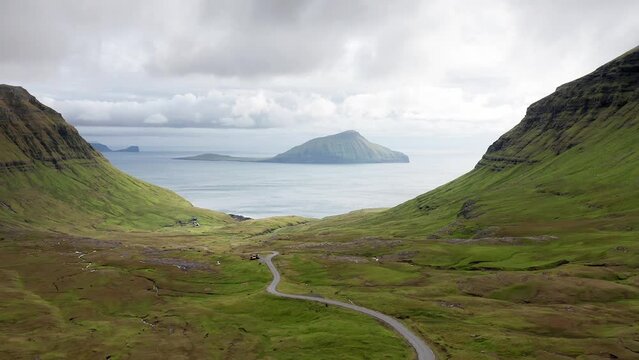Aerial view of wilderness nature,islands, ocean, green mountain and rock cliffs.Impressions of the fascinating archipelago of the Faroe Islands in the North Atlantic Ocean