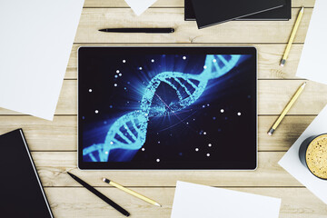 Modern digital tablet monitor with creative DNA hologram. Bio Engineering and DNA Research concept. Top view. 3D Rendering