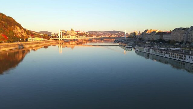 The sun illuminates Elisabeth Bridge and the hills of Budapest
