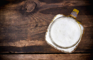 Mug of beer top view with copy space
