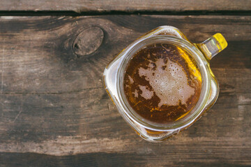 Glass of cold beer on wooden background  with copy space