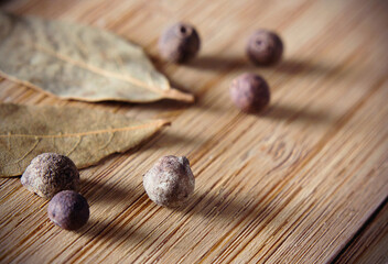 Pepper peas and Bay leaf on a wooden table