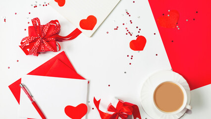 Valentine's day composition with coffee cup and box of paper red hearts on white background. from above. Space for text. Love and Valentine's Day concept. Top view, flat lay.