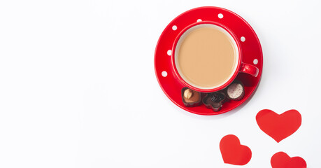Naklejka premium Valentine's day composition with coffee cup and box of chocolate hearts on white background. Love and Valentine's Day concept.