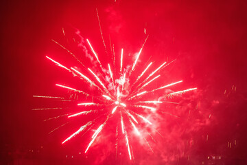 Beautiful colorful fireworks against a dark sky background. Selective focus, background, texture