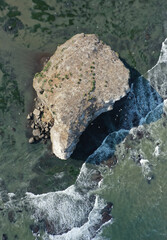 Small island with Seabirds in Tikhaya Bay. Sakhalin Island, Russia.