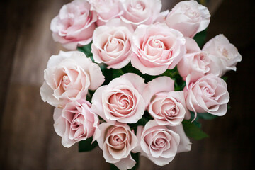 flower wall. background of flowers. large buds of pink roses in an expensive bouquet. close-up of a bouquet of huge pink roses on a light background