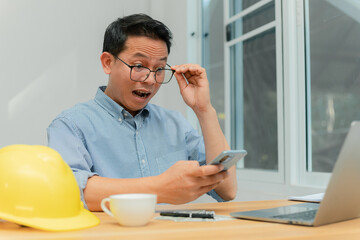 male engineer sitting at office