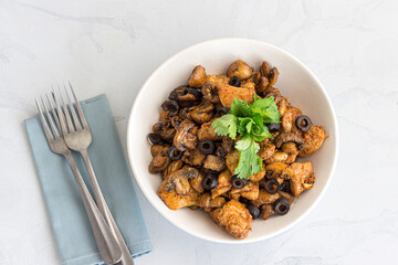 Mushroom Chicken Stir Fry in a Bowl Garnished with Cilantro
